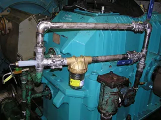 A Magnom Clear unit plumbed into the lubrication line of a gearbox